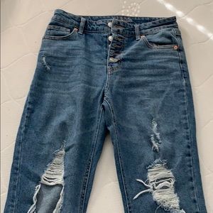 High waisted button fly distressed jeans